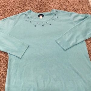 - Soft Sweater with Embellishment at the Neck